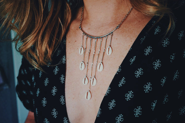 cascading cowrie shell necklace, on model