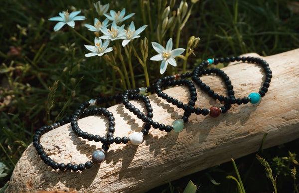 variety of Lava Rock beaded bracelets, each centered with different semiprecious stone beads, product image