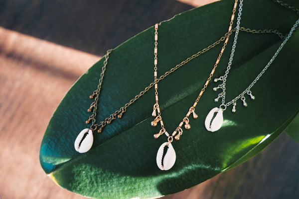 Variety of Candied Cowrie shell necklaces, bronze, gold and silver, product image