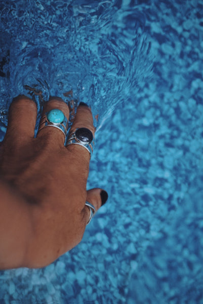 two semiprecious cuff rings, on hand model