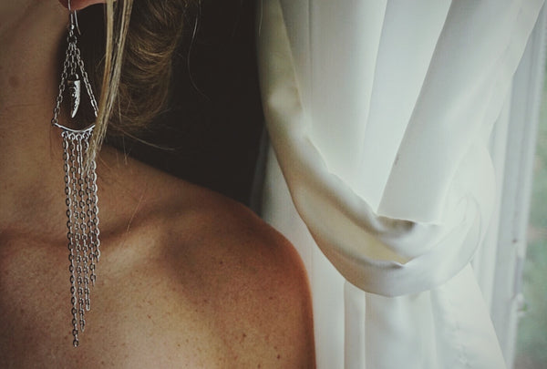 silver, statement earrings, chain, gradually falling, on model