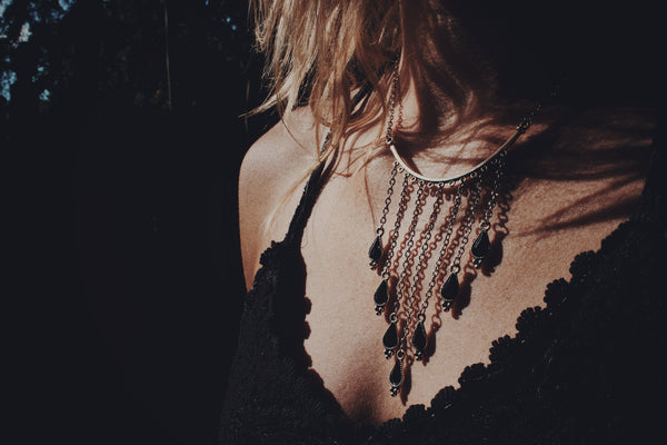 silver, statement necklace, gradually falling, chain, black gem accents, on model