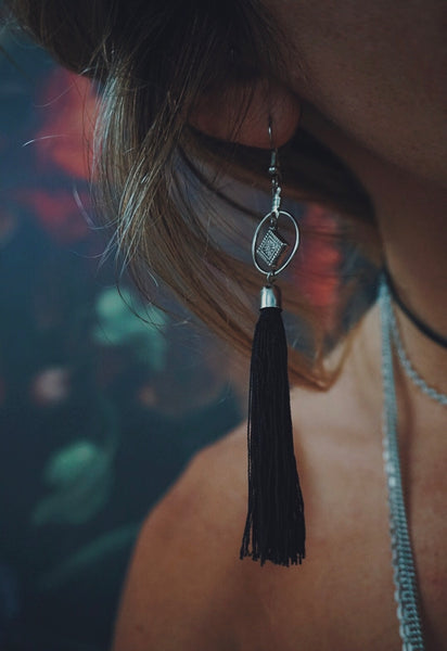 black tassel, silver accent, lightweight, earrings, on model