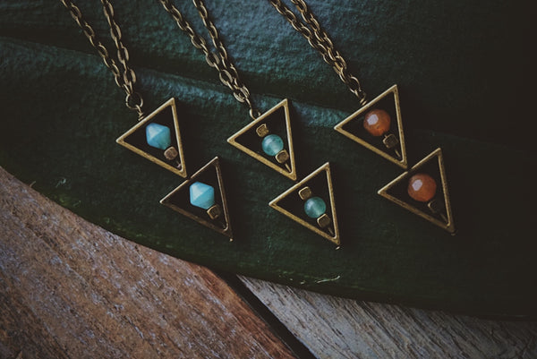 variety of bronze, beaded triangle, necklaces, product image