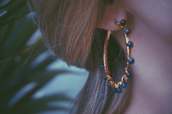 gold & blue sandstone beaded hoops, on model