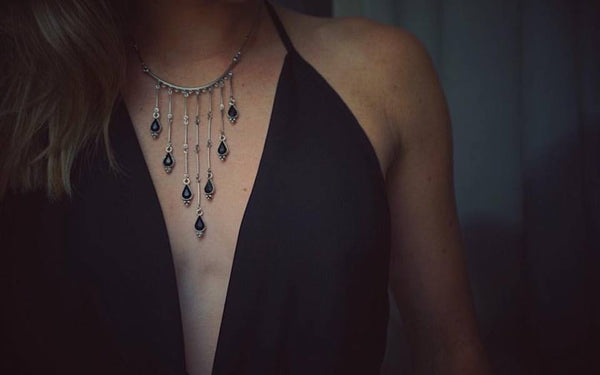 silver, statement necklace, gradually falling, silver bars, black gem accents, on model