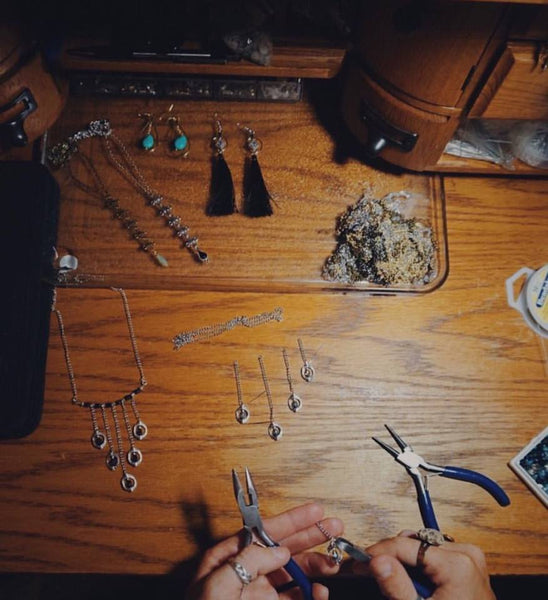 hands creating, silver statement necklaces