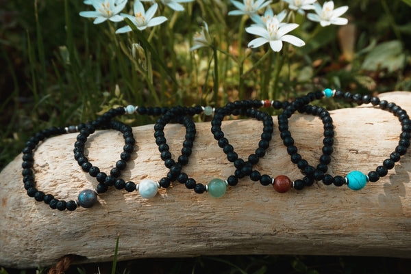variety of Lava Rock beaded bracelets, each centered with different semiprecious stone beads, product image