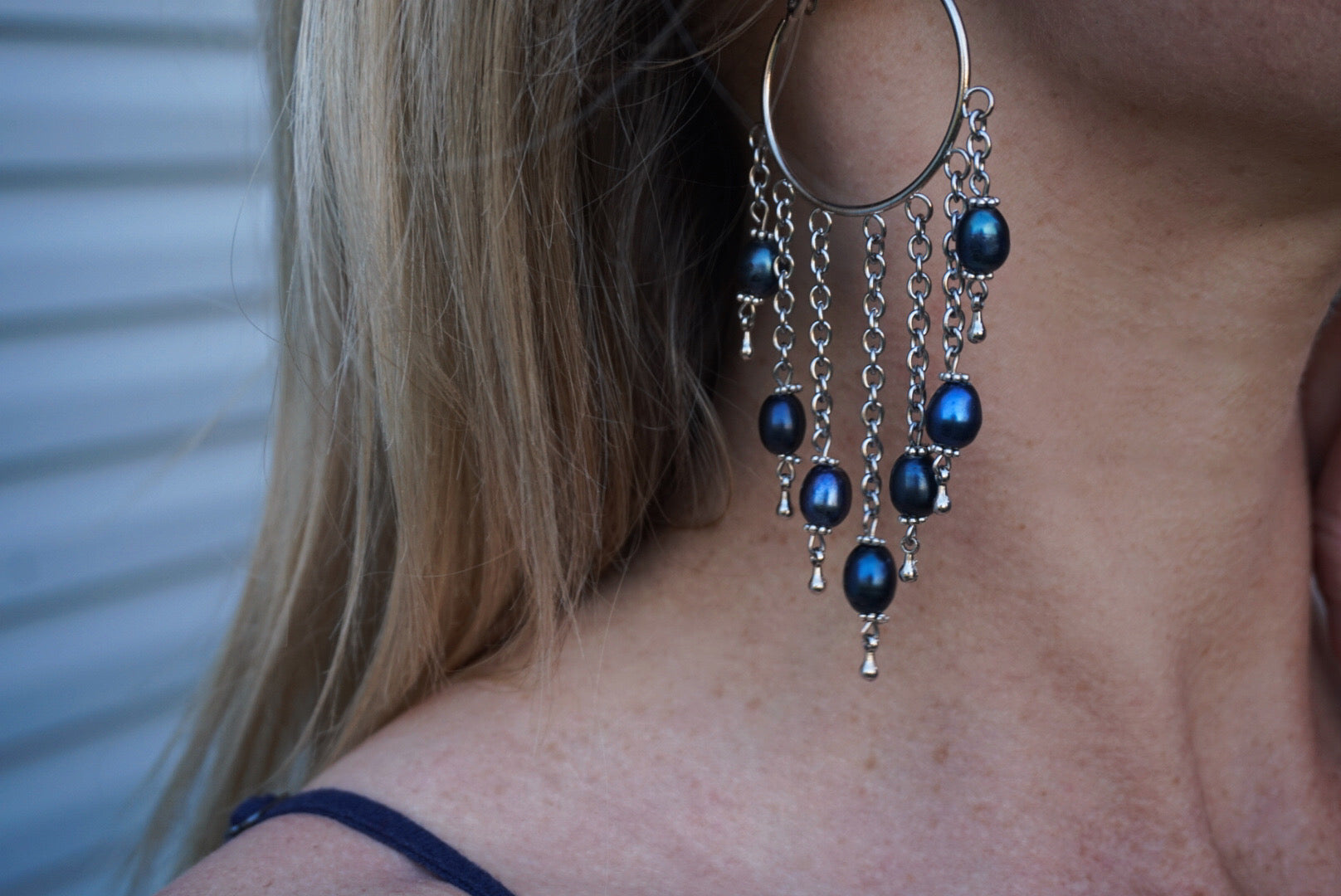 silver hoop earrings, cascading silver chain & freshwater blue pearls, product on model