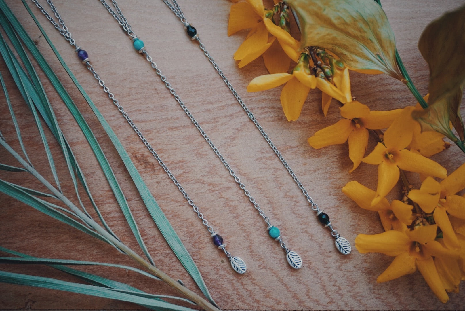 variety of silver Y necklaces, turquoise, amethyst, green sandstone, leaf, product image