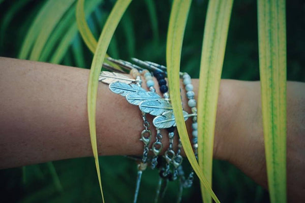 Beaded bracelet stack, silver feather accents, with clasp